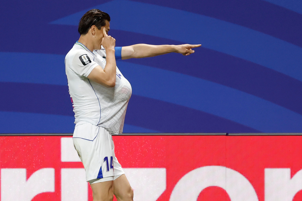 Uzbekistan's Eldor Shomurodov (14) celebrates after scoring their first goal during the World Cup Group K soccer match between DR Congo and Uzbekistan in Atlanta, Saturday, June 27, 2026. (AP Photo/Erik S.Lesser)