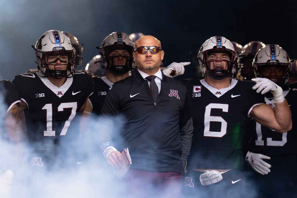Minnesota head coach P.J. Fleck leads his team out of the tunnel before playing Michigan State in an NCAA college football game Saturday, Nov. 1, 2025, in Minneapolis, Minn. (Alex Kormann/Star Tribune via AP)