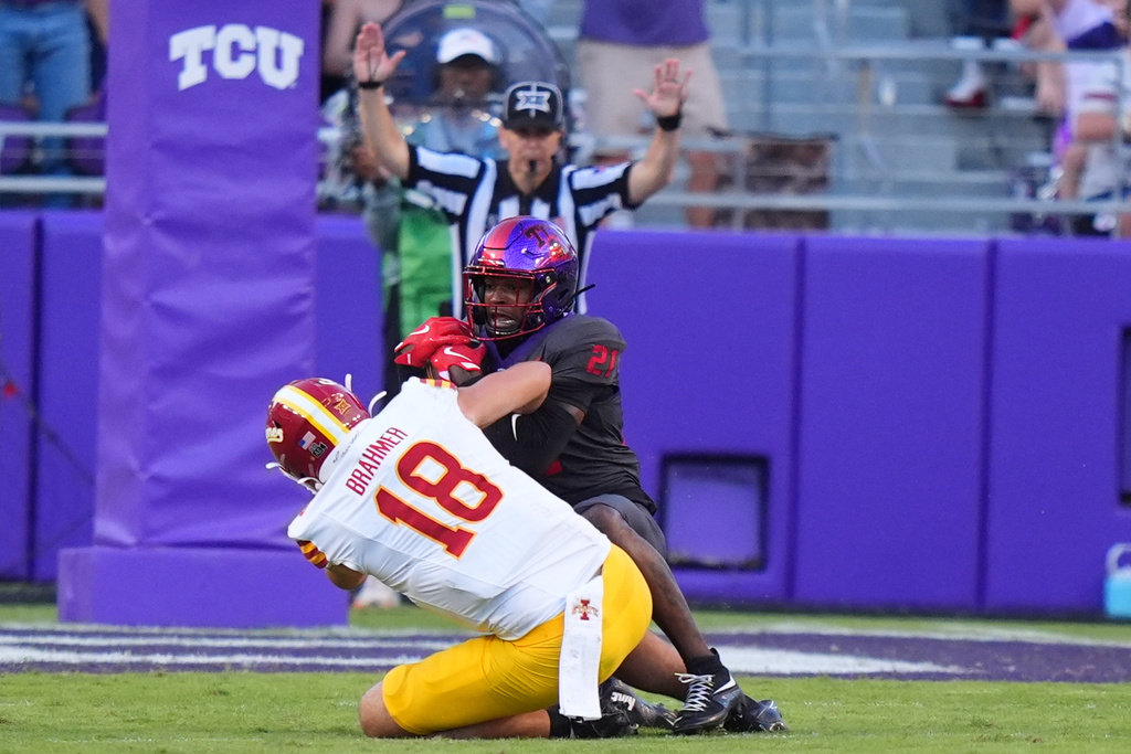 TCU safety Bud Clark (21) intercepts a pass against Iowa State tight end Benjamin Brahmer (18) during the second half of an NCAA college football game Saturday, Nov. 8, 2025, in Fort Worth, Texas. (AP Photo/LM Otero)