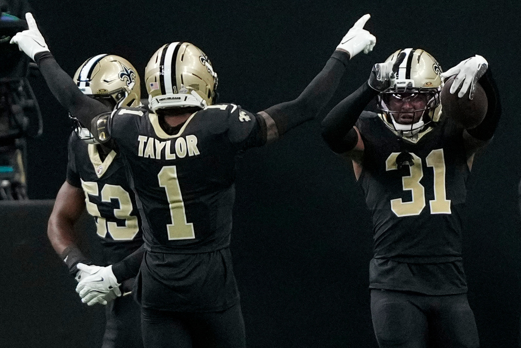New Orleans Saints safety Jordan Howden (31) celebrates his touchdown against the New York Giants in the second half of an NFL football game, Sunday, Oct. 5, 2025, in New Orleans. (AP Photo/Gerald Herbert)