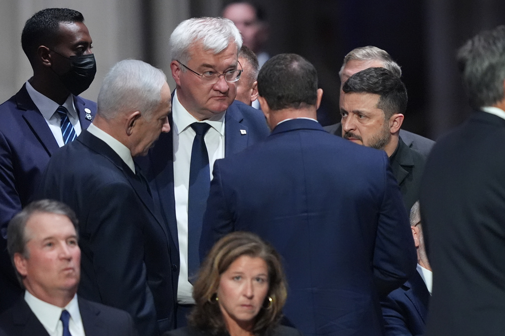 Israeli Prime Minister Benjamin Netanyahu, left, speaks to President of Ukraine, Volodymyr Zelenskyy, before the funeral of Sen. Lindsey Graham, R-S.C., Tuesday July 28, 2026, at the Washington National Cathedral in Washington, as Supreme Court Associate Justice Brett Kavanaugh, is seated left. (AP Photo/Jacquelyn Martin)