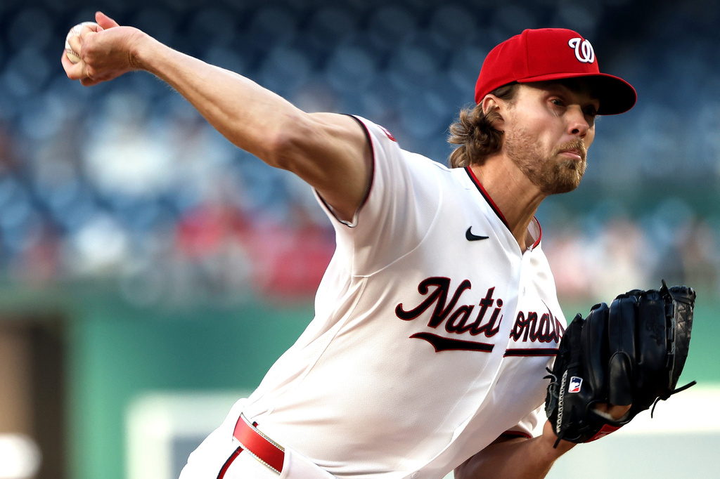 Washington Nationals pitcher Jake Irvin throws during the first inning of a baseball game against the Atlanta Braves, Monday, April 20, 2026, in Washington. (AP Photo/Daniel Kucin Jr.)