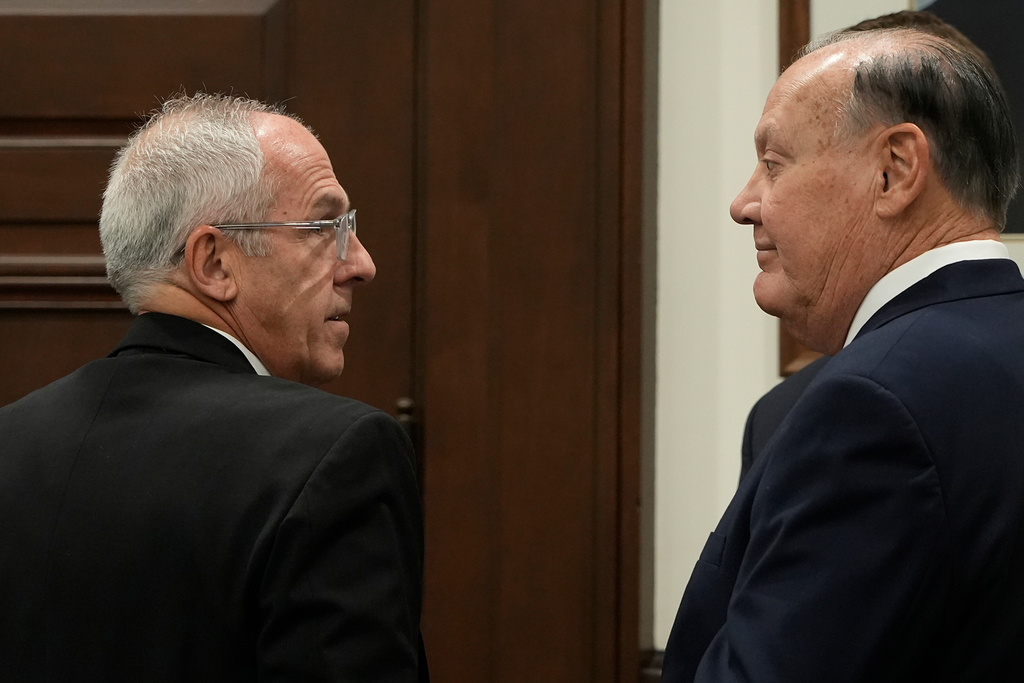 Defendants Michael Dowling, left, and Chuck Jones wait for the start of their trial in Summit County Court of Common Pleas Judge Susan Baker Ross's courtroom on Tuesday, Feb. 3, 2026, in Akron, Ohio. (Mike Cardew/Akron Beacon Journal via AP, Pool)