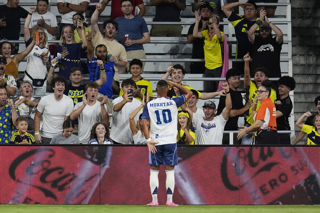 Nashville SC midfielder Hany Mukhtar (10) celebrates scoring a goal during the first half of an MLS soccer match against Orlando City, Saturday, Aug. 23, 2025, in Nashville, Tenn. (AP Photo/George Walker IV)