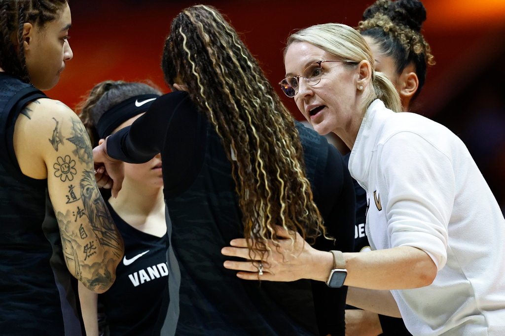 FILE - Vanderbilt head coach Shea Ralph, right, talks to guard Mikayla Blakes, center, and others during a timeout in the second half of an NCAA college basketball game against Tennessee in Knoxville, Tenn., March 1, 2026. (AP Photo/Wade Payne, File)