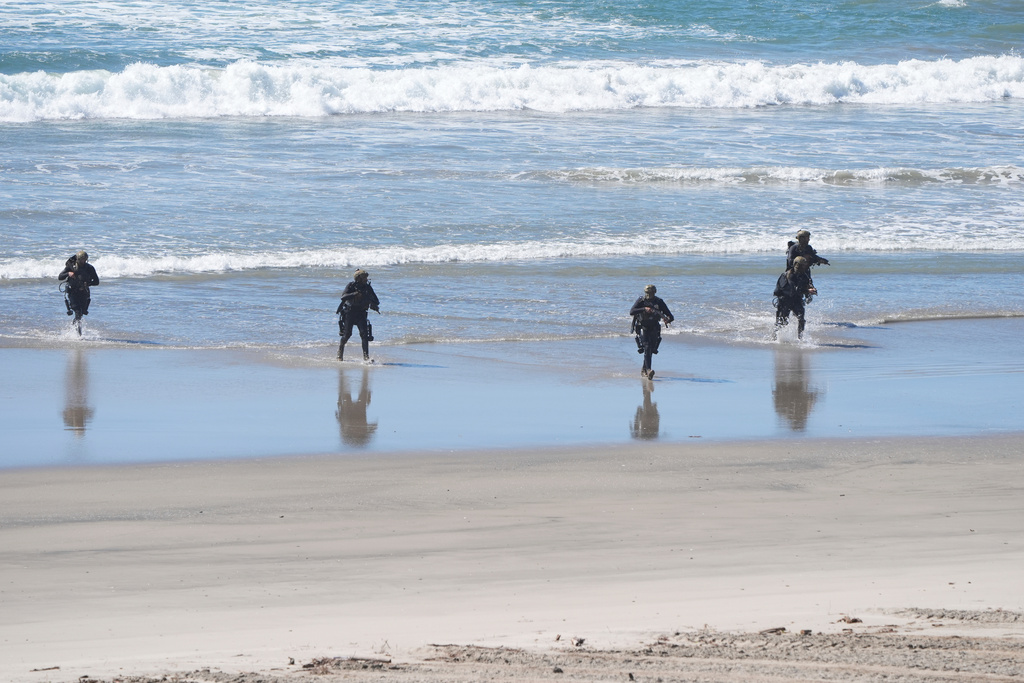 Marines perform a demonstration as Vice President JD Vance, not pictured, watches to mark the upcoming Marine Corps' 250th anniversary Saturday, Oct 18, 2025, on Marine Corps Base Camp Pendleton in Camp Pendleton, Calif. (AP Photo/Gregory Bull)