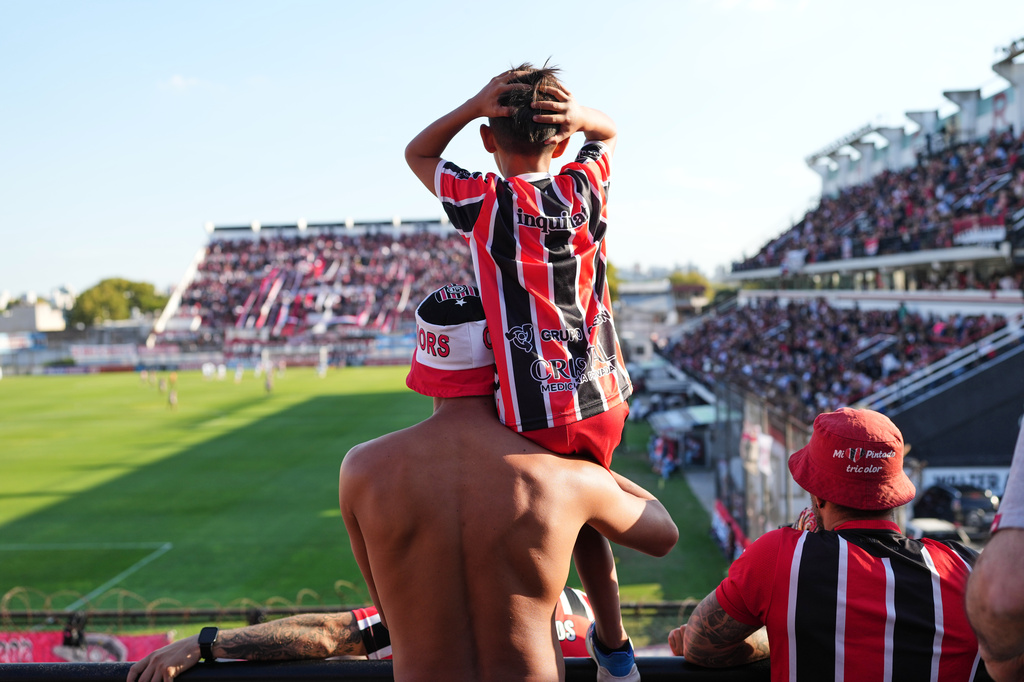 Chacarita Juniors fans react during an Argentine league against Gimnasia y Tiro in Buenos Aires, Argentina, Sunday, April 12, 2026. (AP Photo/Rodrigo Abd)
