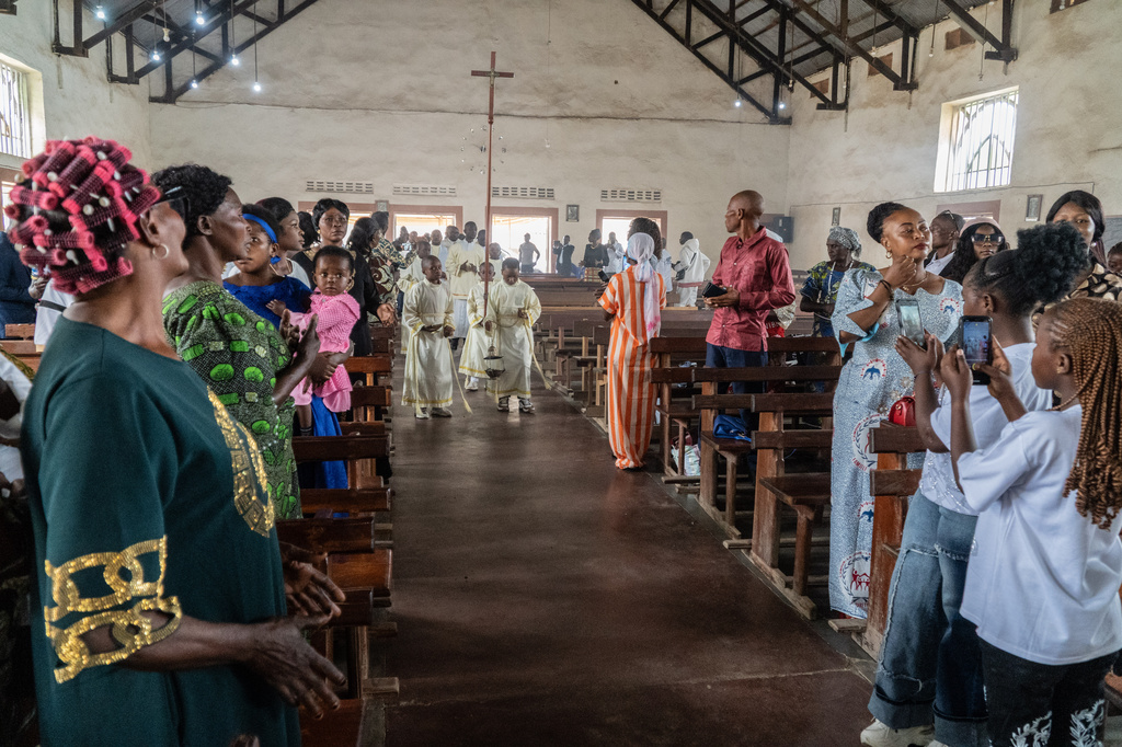 Altar boys arrive at a chapel during a wedding ceremony amid an Ebola outbreak in Ituri Province in Bunia, Congo, Saturday, June 6, 2026. (AP Photo/Moses Sawasawa)