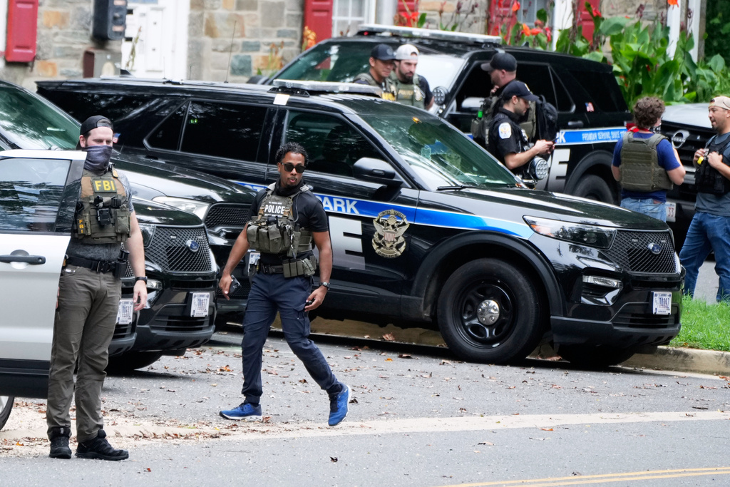 Officers from various federal agencies including Homeland Security Investigations, FBI, Department of Homeland Security from the Boston Field Office, and U.S. Park Police prepare for patrols at the U.S. Park Police Rock Creek Station, Thursday, Aug. 21, 2025, in Washington. (AP Photo/Jacquelyn Martin)