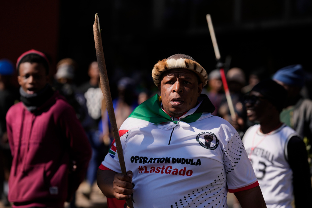 Protesters march against illegal immigration, in Johannesburg, South Africa, Tuesday, June 30, 2026. (AP Photo/Themba Hadebe)