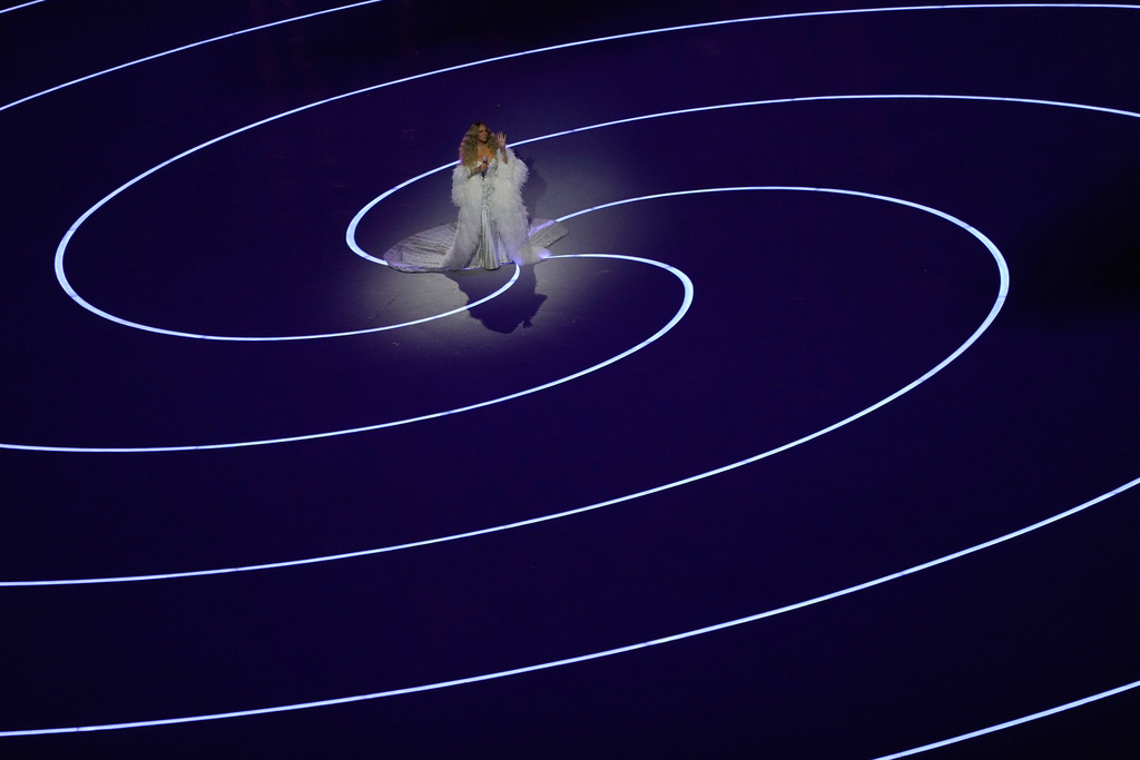 Singer Mariah Carey performs during the Olympic opening ceremony at the 2026 Winter Olympics, in Milan, Italy, Friday, Feb. 6, 2026. (AP Photo/Francisco Seco)