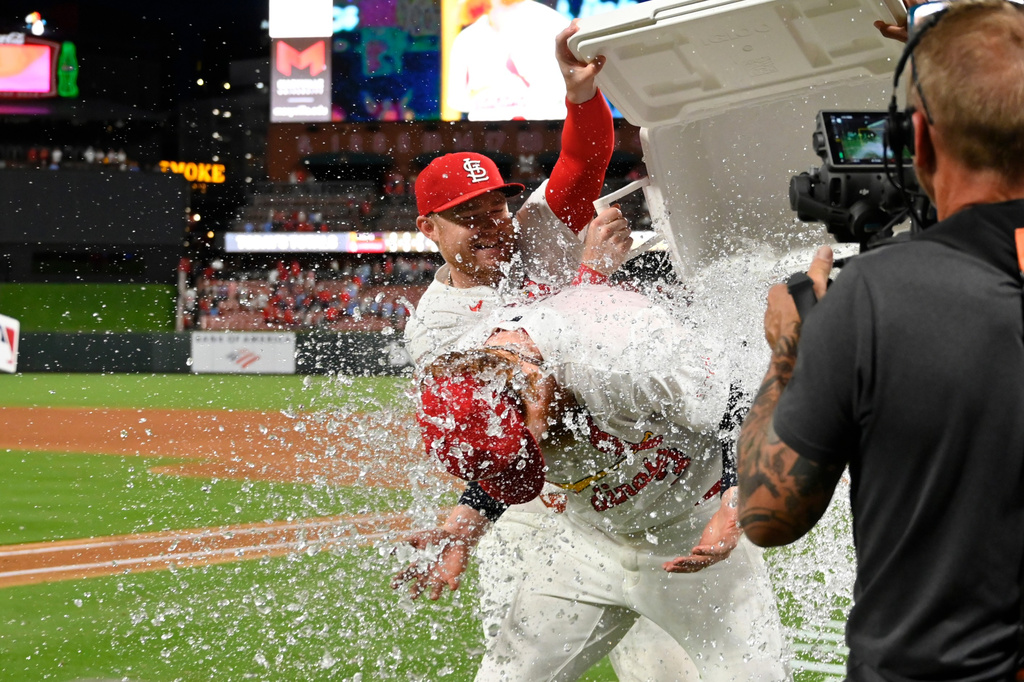 St. Louis Cardinals starting pitcher Dustin May, center, is doused after the team defeated the San Diego Padres in a baseball game, Monday, June 15, 2026, in St. Louis. (AP Photo/Joe Puetz)