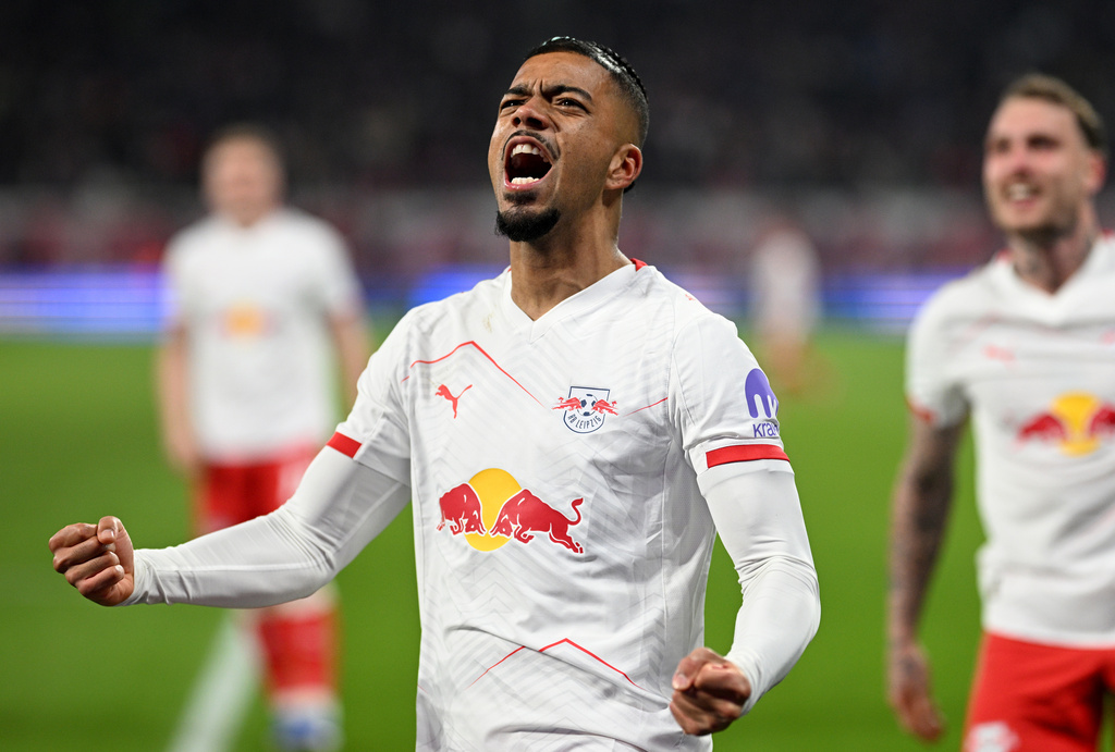 20 March 2026, Saxony, Leipzig: Soccer, Men: Bundesliga, RB Leipzig - TSG 1899 Hoffenheim, Matchday 27, Red Bull Arena. RB Leipzig's Benjamin Henrichs celebrates scoring against TSG 1899 Hoffenheim during a Bundesliga soccer match, Friday, March 20, 2026, in Leipzig, Germany. (Julius Frick/dpa via AP)