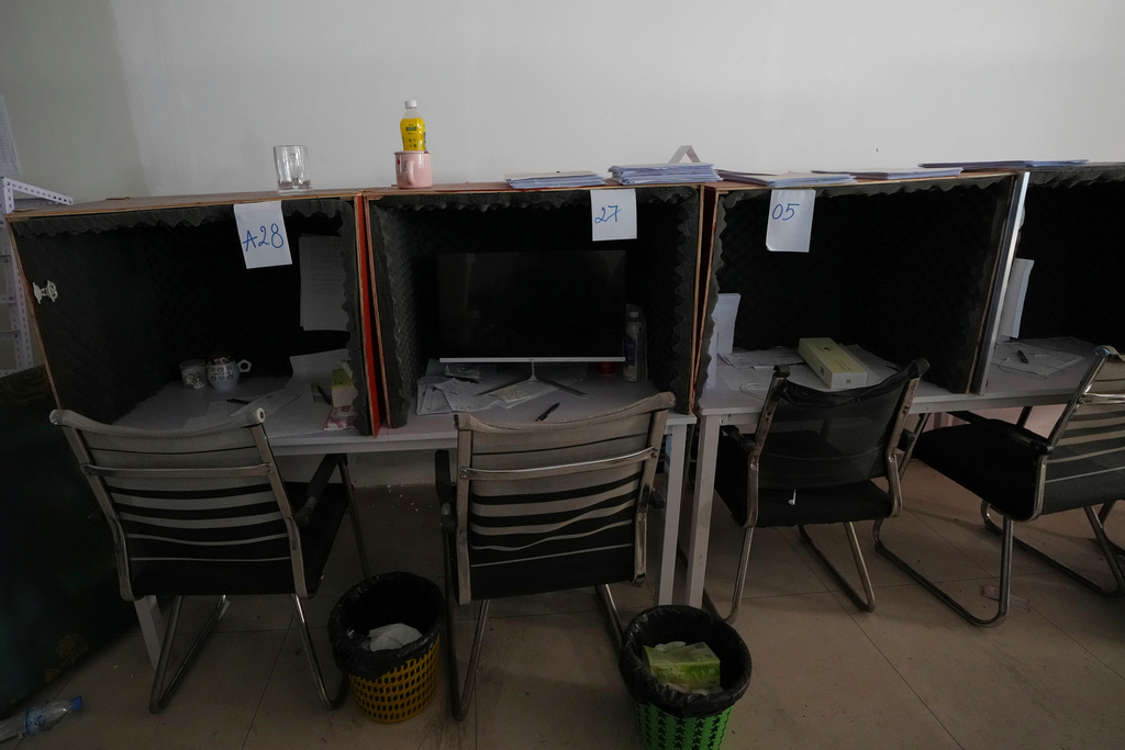 A work station lined with foam for soundproofing is seen inside a scam compound in O'Smach, Cambodia, Monday, Feb. 2, 2026, (AP Photo/Sakchai Lalit)