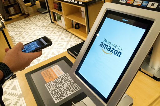 FILE - Daniel Thorpe, of Hoboken, N.J., uses the Amazon app to pay for his purchase at the Amazon 4-star store in the Soho neighborhood of New York, on Sept. 27, 2018. (AP Photo/Mary Altaffer, File) FILE - Daniel Thorpe, of Hoboken, N.J., uses the Amazon app to pay for his purchase at the Amazon 4-star store in the Soho neighborhood of New York, on Sept. 27, 2018. (AP Photo/Mary Altaffer, File)