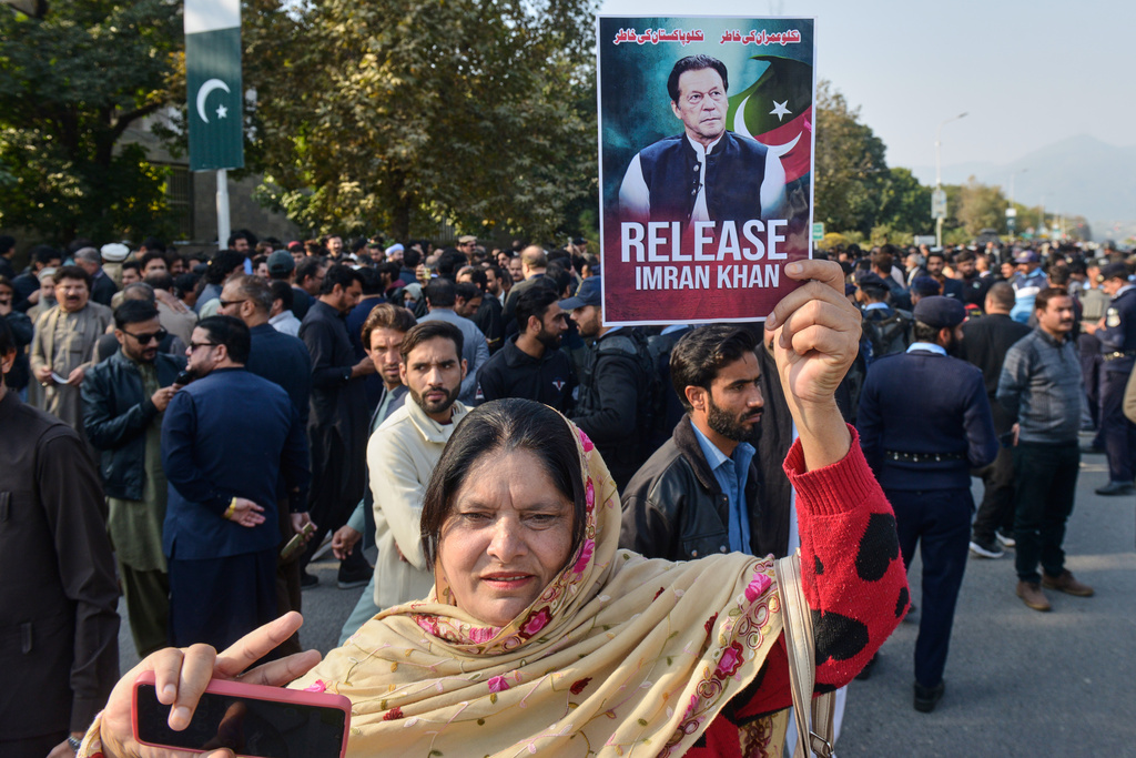 Supporters of Pakistan's imprisoned former Prime Minister Imran Khan hold a demonstration outside Islamabad High Court, in Islamabad, Pakistan, Tuesday, Dec. 2, 2025. (AP Photo/A. Sheikh)