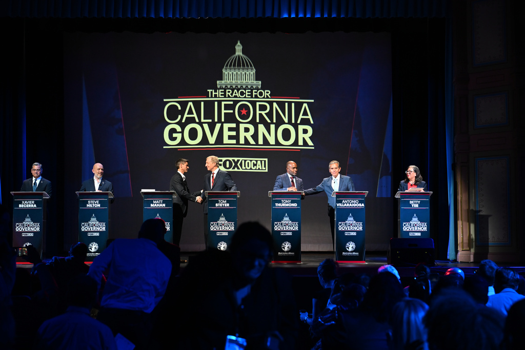 From left, Xavier Becerra, Steve Hilton, Matt Mahan, Tom Steyer, Tony Thurmond, Antonio Villaraigosa and Betty Yee stand on the stage during the California gubernatorial candidate debate Tuesday, Feb. 3, 2026, in San Francisco. (AP Photo/Laure Andrillon)