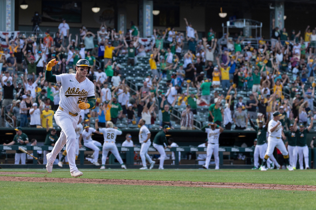 Athletics' Brent Rooker runs the bases after hitting a walk-off three-run home run during the 10th inning of a baseball game against the Houston Astros Sunday, April 5, 2026, in West Sacramento, Calif. (AP Photo/Sara Nevis)