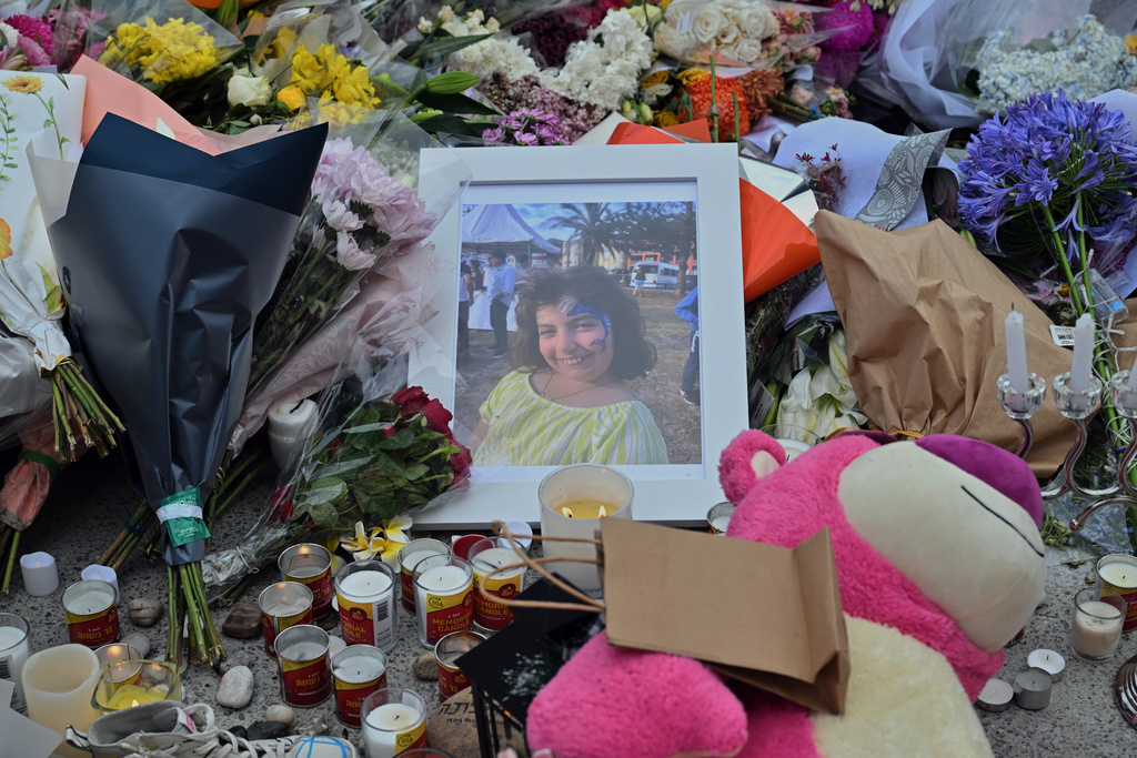 A photo of shooting victim Matilda, a 10-year-old whose last name has been withheld at the request of her family, is placed amongst flowers at a memorial made at the Bondi Pavilion in Sydney, Dec. 17, 2025, following Sunday's shooting. (Mick Tsikas/AAP Image via AP)