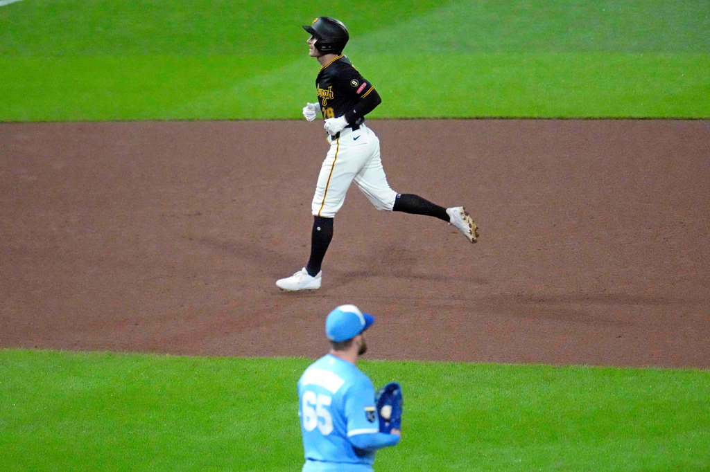 Pittsburgh Pirates' Jake Mangum, top, rounds the bases after hitting a two-run home run off Kansas City Royals pitcher Noah Cameron (65) during the fourth inning of a baseball game in Pittsburgh, Saturday, Sept. 19, 2026. (AP Photo/Gene J. Puskar)