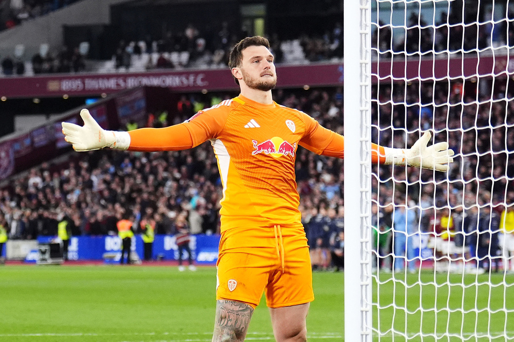 Leeds United goalkeeper Lucas Perri celebrates saving West Ham United's Jarrod Bowen penalty in the shoot-out during the English FA Cup quarterfinal soccer match between West Ham United and Leeds United, in London, Sunday April 5, 2026. (John Walton/PA via AP)