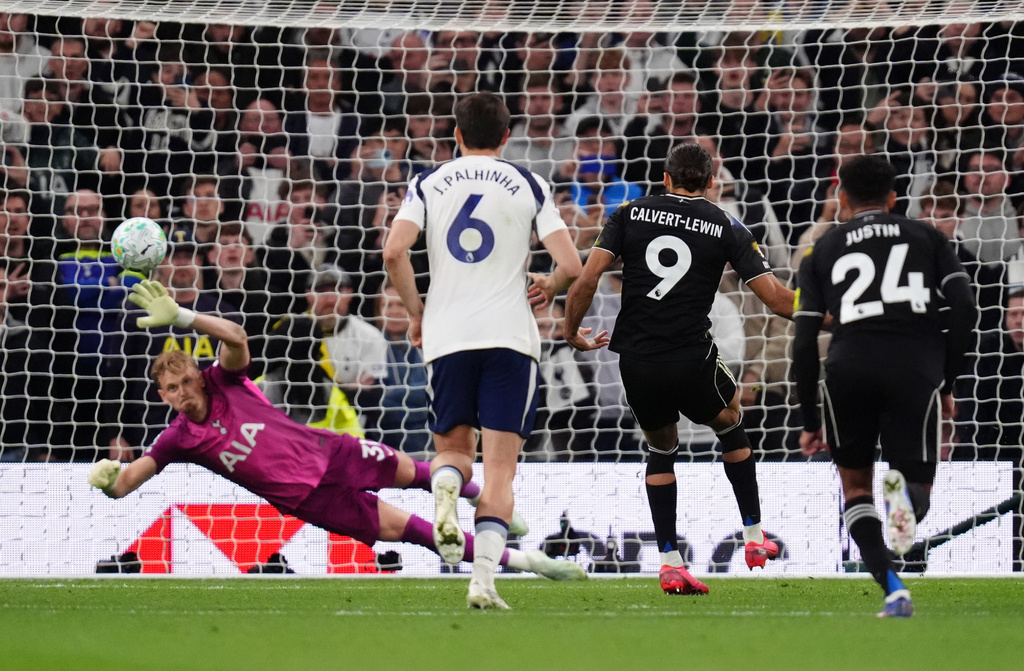 Leeds United's Dominic Calvert-Lewin scores their side's first goal of the game from a penalty during the English Premier League soccer match between Totteham Hotspur and Leeds United in London, Monday, May 11, 2026. (John Walton/PA via AP)