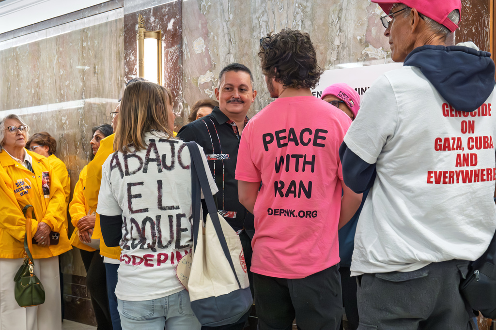 People wait to enter the Senate Foreign Relations Committee hearing room before lawmakers question Secretary of State Marco Rubio, at the Capitol in Washington, Tuesday, June 2, 2026. (AP Photo/J. Scott Applewhite)