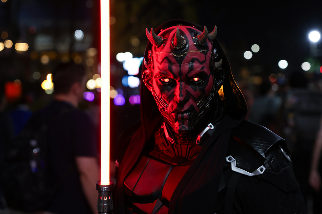 Ray Buckalew of San Diego dressed as Darth Maul poses for a photograph during preview night of Comic-Con International on Wednesday, July 22, 2026, in San Diego. (Photo by Andrew Park/Invision/AP)
