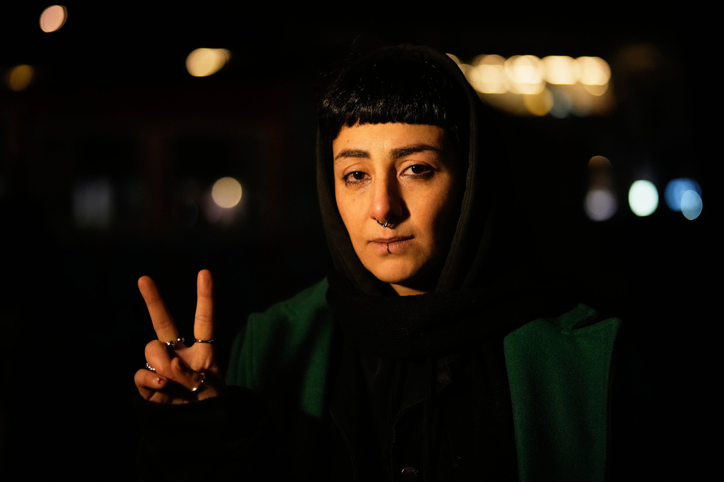 Iranian Anahita Safarnejad, 34, poses for a photo after a demonstration in support of the nationwide mass protests in Iran against the government, in Berlin, Germany, Wednesday, Jan. 14, 2026. (AP Photo/Ebrahim Noroozi)