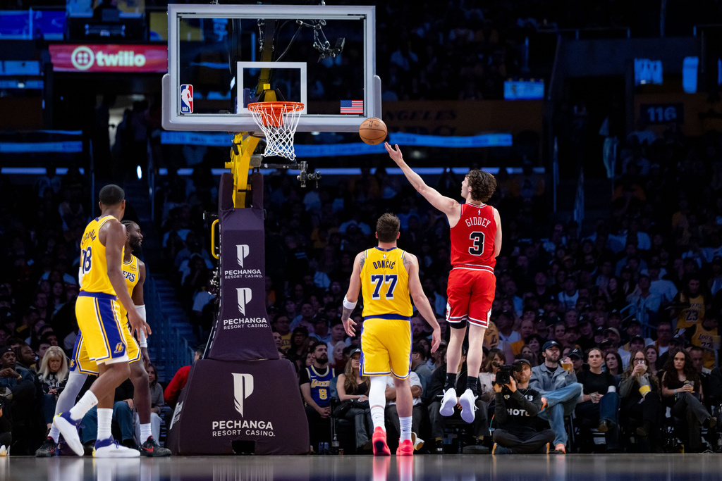 Chicago Bulls guard Josh Giddey (3) goes to the basket against the Los Angeles Lakers during the first half of an NBA basketball game, Thursday, March 12, 2026, in Los Angeles. (AP Photo/Ethan Swope)
