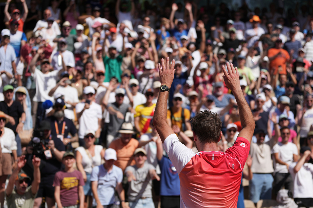 Stan Wawrinka of Switzerland waves to fans after the first round men's singles tennis match against Jesper De Jong of the Netherlands at the French Open tennis tournament in Paris, Monday, May 25, 2026. (AP Photo/Thibault Camus)