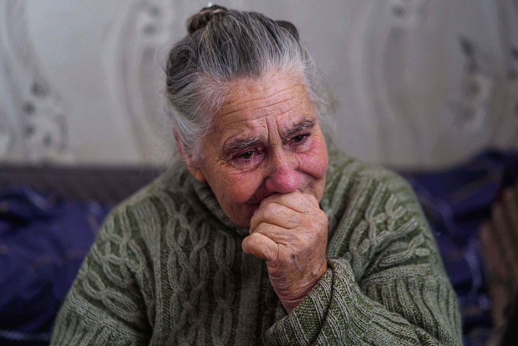 Valentyna, 75, tests at a hostel for displaced people in Dnipro, Ukraine, Wednesday, Oct. 8, 2025. (AP Photo/Evgeniy Maloletka)