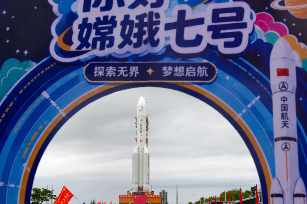 In this photo released by Xinhua News Agency, the combination of the Chang'e-7 lunar probe and the Long March-5 Y14 carrier rocket is transferred vertically to the launching area at the Wenchang Spacecraft Launch Site in southern China's Hainan Province on Wednesday, Aug. 19, 2026 . (Yang GuanyuXinhua via AP)