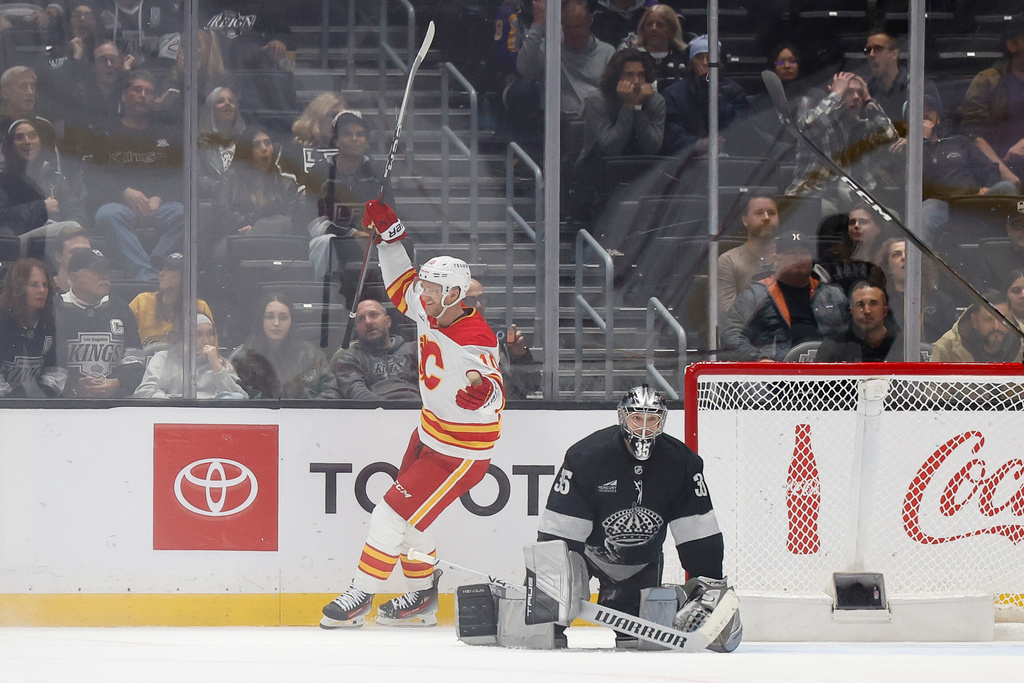 Calgary Flames left wing Jonathan Huberdeau (10) reacts as the Calgary Flames defeat the Los Angeles Kings in overtime of an NHL hockey game Saturday, Dec. 13, 2025, in Los Angeles. (AP Photo/Caroline Brehman)