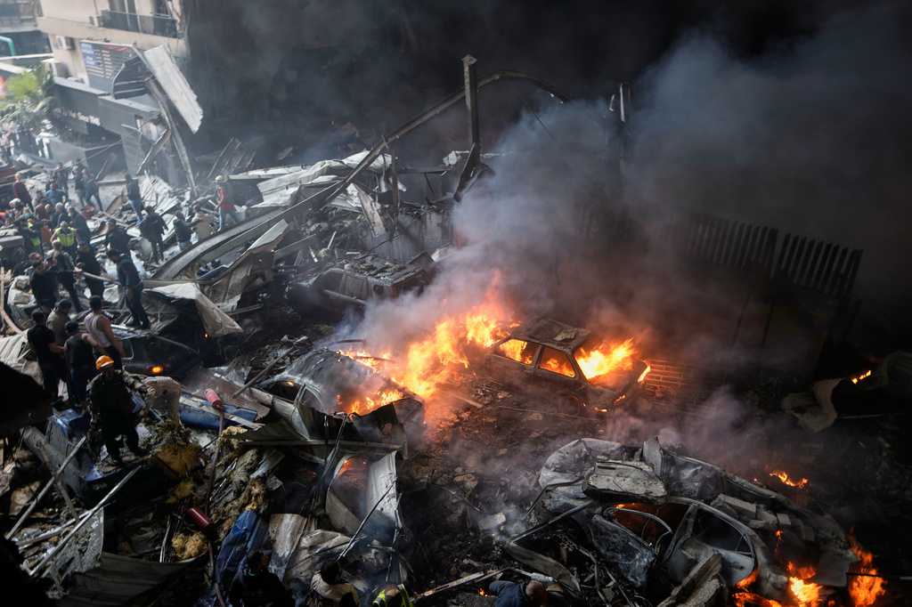 First responders work at the site of an Israeli airstrike that struck an apartment building in Beirut, Lebanon, Wednesday, April 8, 2026. (AP Photo/Bilal Hussein)