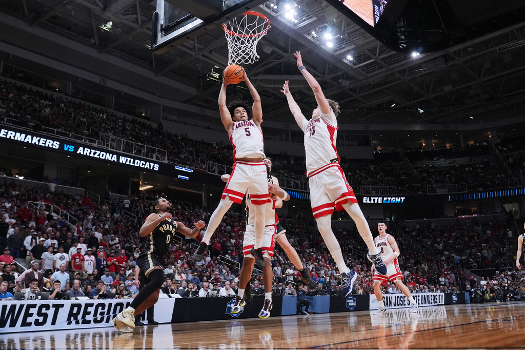 Arizona guard Brayden Burries (5) grabs a rebound during the second half in the Elite Eight of the NCAA college basketball tournament against Purdue, Saturday, March 28, 2026, in San Jose, Calif. (AP Photo/Godofredo A. Vásquez)