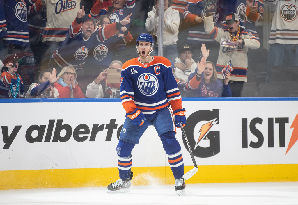 Edmonton Oilers' Connor McDavid (97) celebrates his game-winning goal against the Washington Capitals during overtime NHL action in Edmonton, Alberta, Saturday, Jan. 24, 2026. (Jason Franson/The Canadian Press via AP)