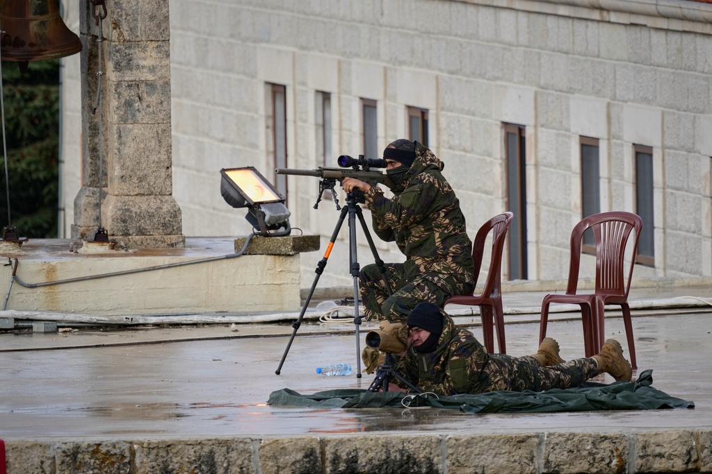Lebanese security personnel deploy on the roof of the Monastery of Saint Maroun ahead of Pope Leo XIV's arrival in Annaya, Lebanon, Monday, Dec. 1, 2025. (AP Photo/Hassan Ammar)