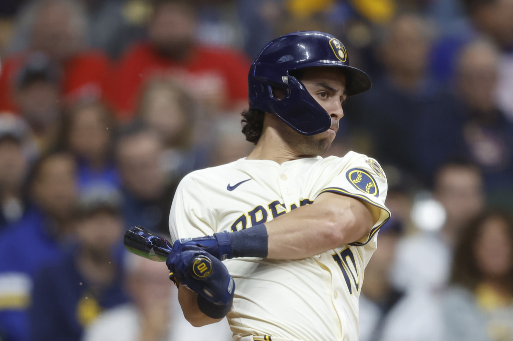 Milwaukee Brewers' Sal Frelick (10) hits a two-run single during the first inning of a baseball game against the Philadelphia Phillies, Wednesday, Sept. 3, 2025, in Milwaukee. (AP Photo/Jeffrey Phelps)