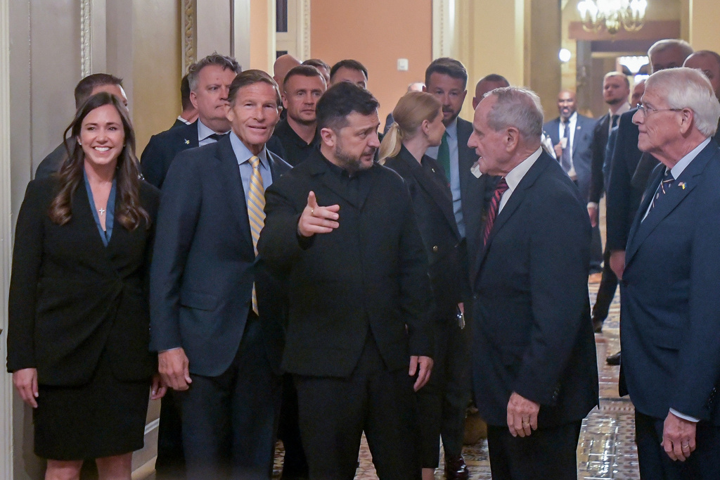 Ukraine's President Volodymyr Zelenskyy, center, is joined by from left: Sen. Katie Britt, R-Ala., Sen. Richard Blumenthal, D-Conn., Sen. James Risch, R-Idaho, and Sen. Roger Wicker, R-Miss., as he arrives at the U.S. Capitol for a meeting of bipartisan leaders of the Lindsey O. Graham Sanctioning Russia and Iran Act of 2026, Tuesday, July 28, 2026, in Washington. (AP Photo/Rod Lamkey, Jr.)