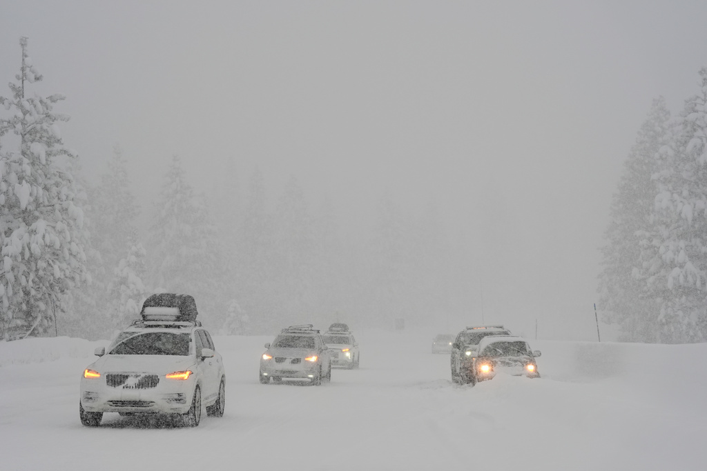 Motorists make their way along interstate 80 during a snow storm Thursday, Feb. 19, 2026, near Camp Spaulding in Placer County, Calif. (AP Photo/Godofredo A. Vásquez)