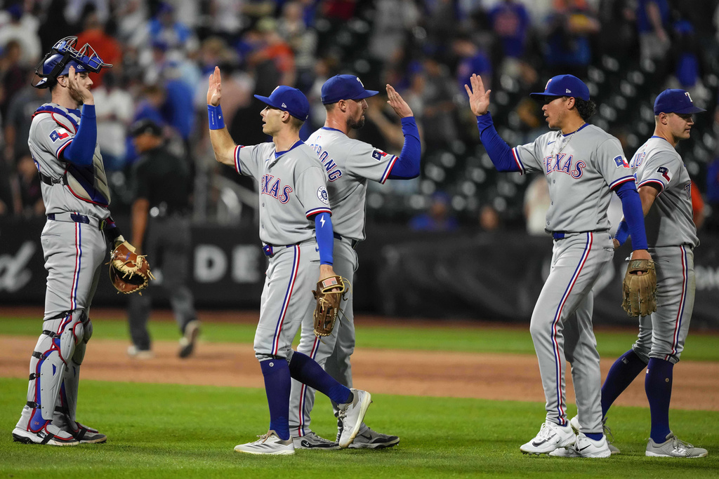 Players of Texas Rangers celebrates after winning a baseball game against the New York Mets, Saturday, Sept. 13, 2025, in New York. (AP Photo/Yuki Iwamura)