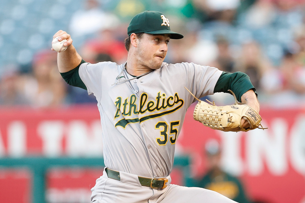 Athletics starting pitcher J.T. Ginn throws during the first inning of a baseball game against the Los Angeles Angels, Friday, June 26, 2026, in Anaheim, Calif. (AP Photo/Caroline Brehman)