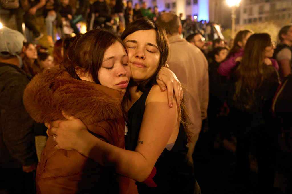 People gather to remember Carlos Alberto Solari, the Argentine singer-songwriter known as "the Indio" who led Patricio Rey y sus Redonditos de Ricota, on the day of his death, at Plaza de Mayo square in Buenos Aires, Argentina, Friday, June 5, 2026. (AP Photo/Victor R. Caivano)