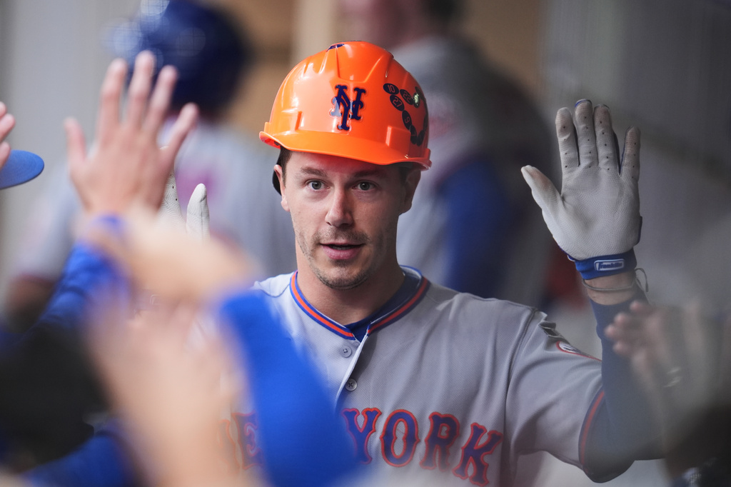 New York Mets' Jared Young celebrates his home run with teammates in the dugout during the second inning of a baseball game against the San Diego Padres Friday, June 5, 2026, in San Diego. (AP Photo/Gregory Bull)