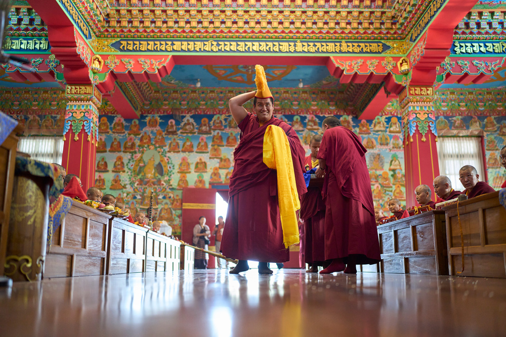 Jalue Dorje adjusts his ceremonial hat before starting a ritual at Dzarong Thubten Mindrol Dongä Monastery in Kathmandu, Nepal, Tuesday, April 14, 2026. (AP Photo/Niranjan Shrestha)