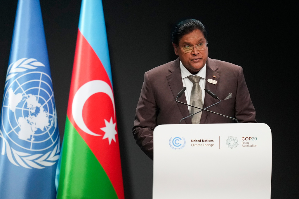FILE - Suriname President Chandrikapersad Santokhi speaks during a plenary session at the COP29 U.N. Climate Summit, Nov. 12, 2024, in Baku, Azerbaijan. (AP Photo/Rafiq Maqbool, File)