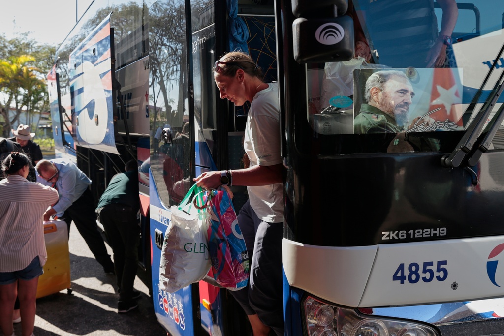 Russian tourists arrive at the airport in Varadero, Cuba, Thursday, Feb. 12, 2026. (AP Photo/Jorge Luis Banos)