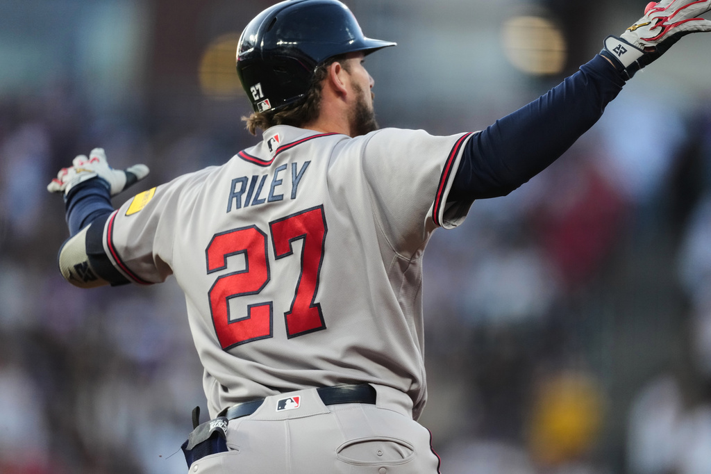 Atlanta Braves' Austin Riley gestures to the bullpen as he circles the bases after hitting a two-run home run off Colorado Rockies relief pitcher Chase Dollander in the fifth inning of a baseball game Saturday, May 2, 2026, in Denver. (AP Photo/David Zalubowski)