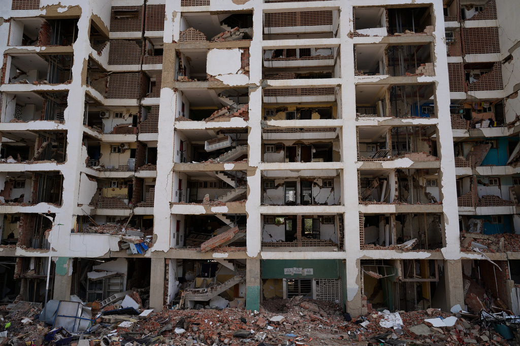 FILE - An O-P-P housing tower built as part of a government program, which partially collapsed after twin earthquakes, stands in La Guaira, Venezuela, July 2, 2026. (AP Photo/Ariana Cubillos, File)